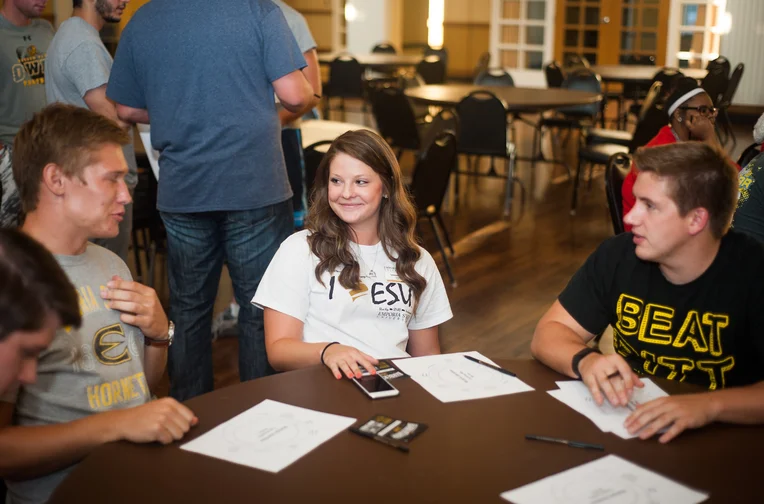 Students sitting at table talking