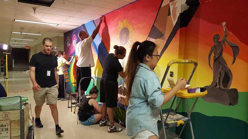 Students paint a wall